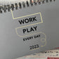 Work Play Every Day planner on a rag rug